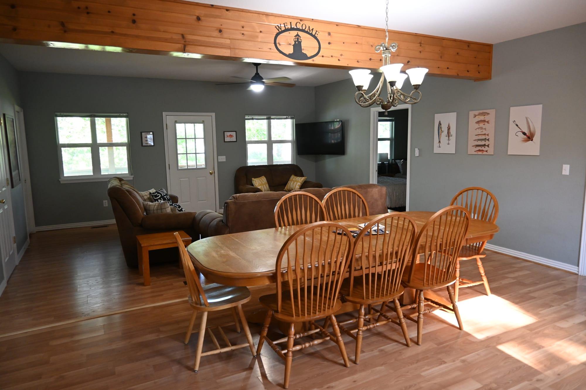 Living room with lake-facing windows in Suite 1