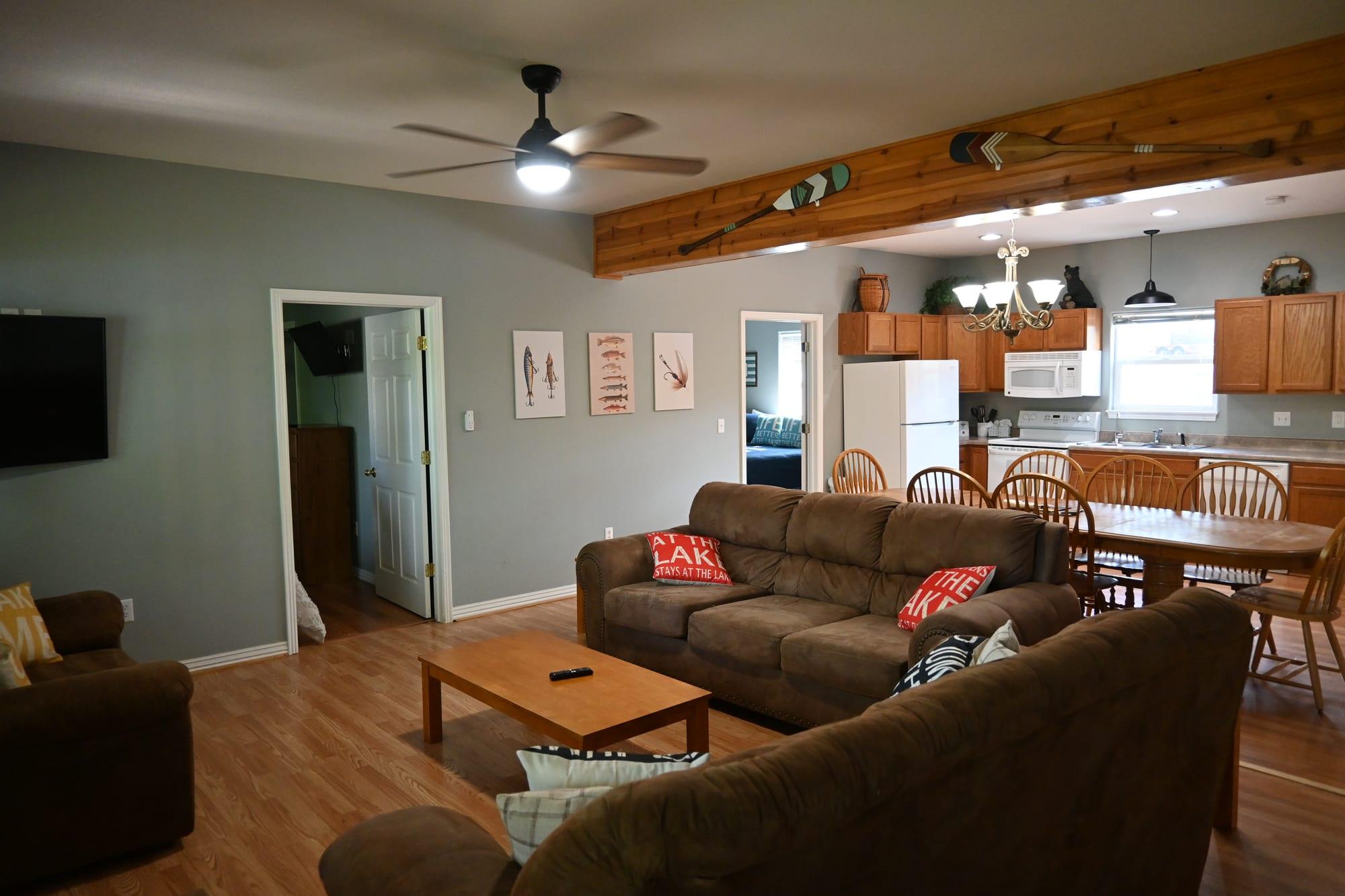 Furnished living room and dining space in Suite 1