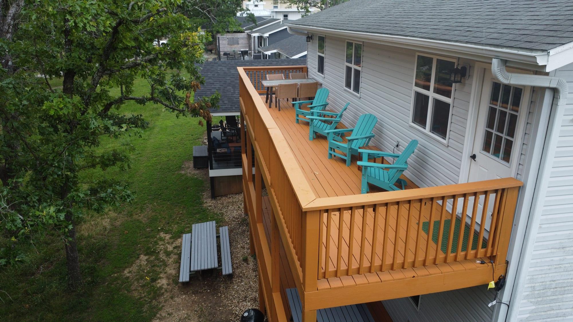Outdoor seating on the covered deck of Suite 2