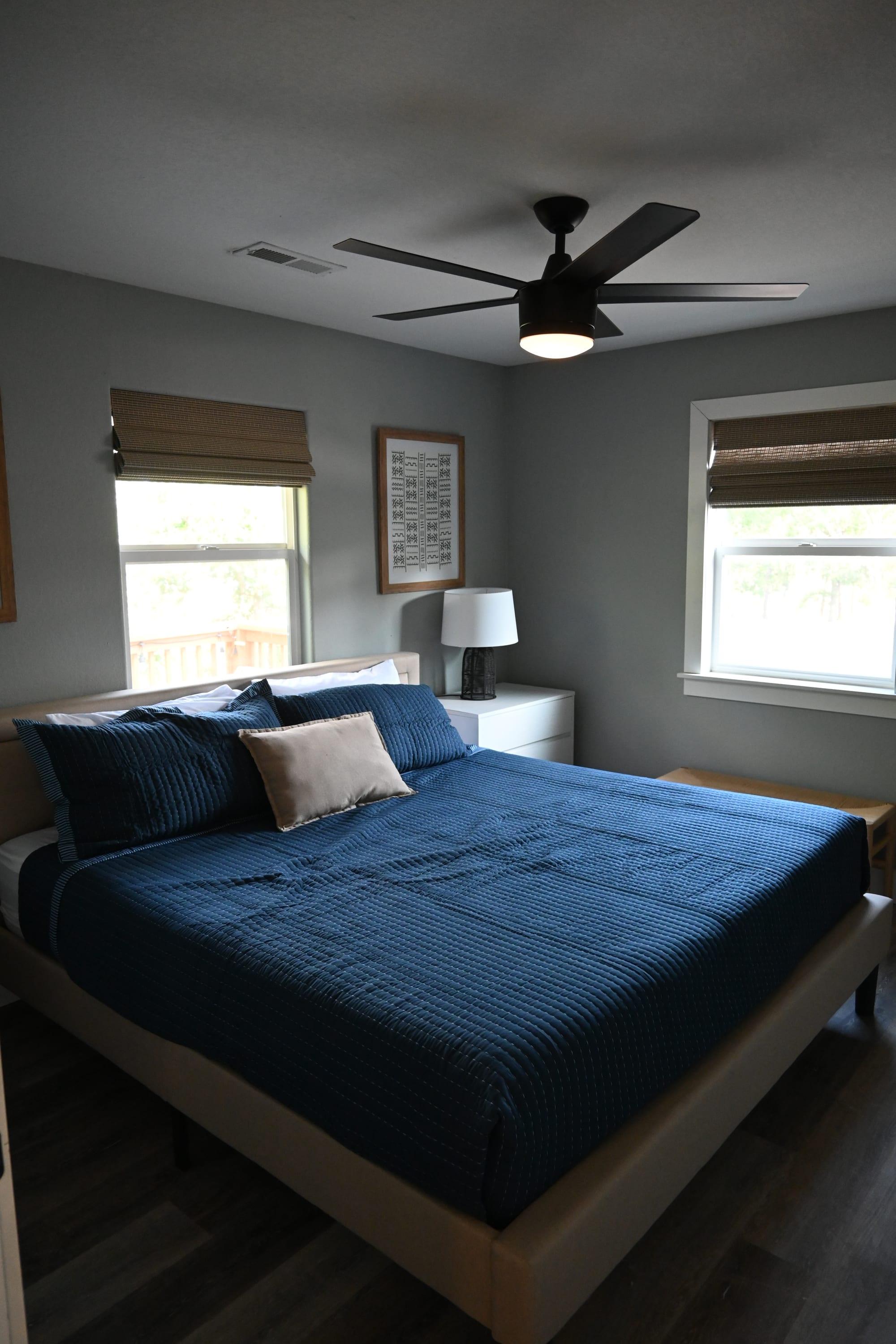 Primary bedroom with king bed in Suite 2