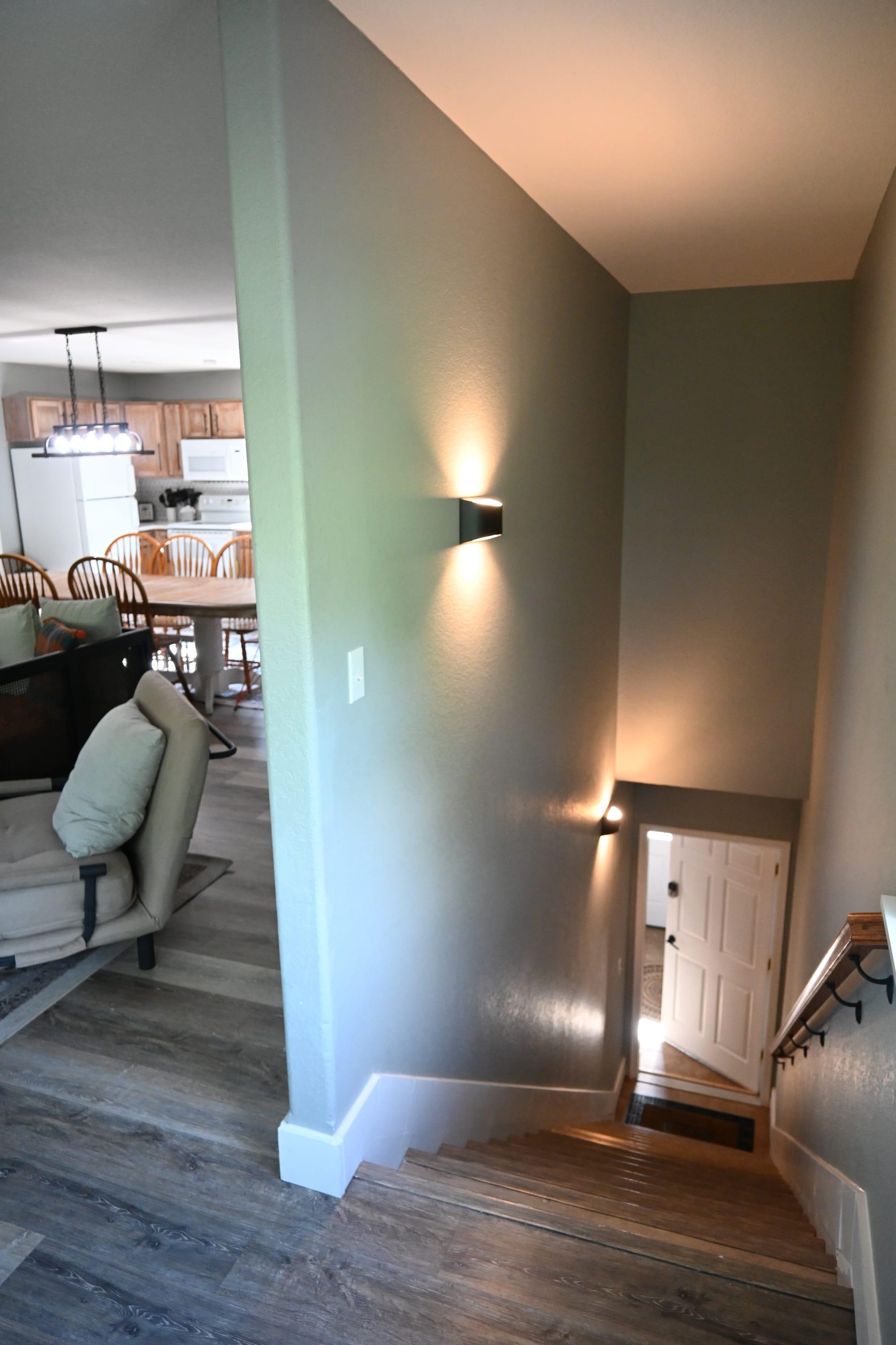 Two-story stairwell connecting the living level and bedrooms in Suite 2